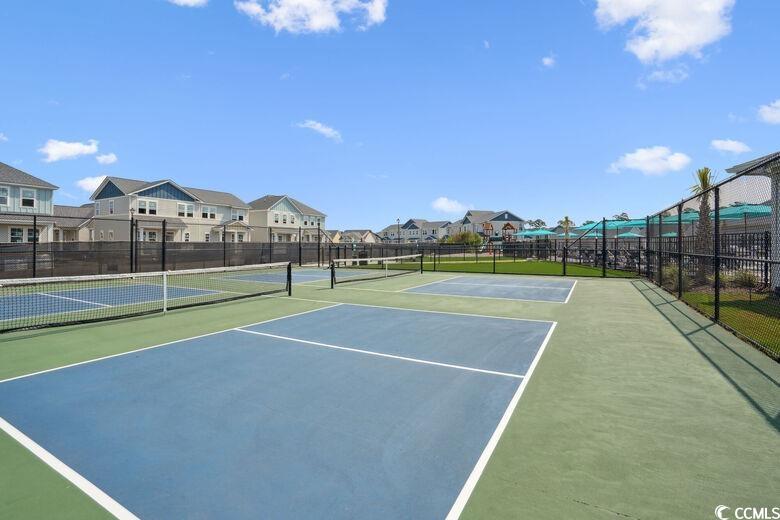 8840 Henry Road, Unit LANTANA Longs, SC 29568 - Photo 28 of 30 View of tennis court with a residential view and community basketball court