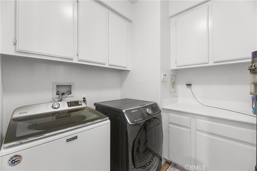 43312 Dodaro Drive Temecula, CA 92592 - Photo 11 of 58 a utility room with dryer and washer