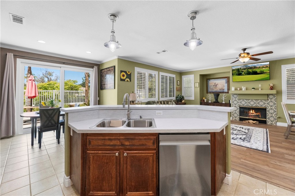 43312 Dodaro Drive Temecula, CA 92592 - Photo 21 of 58 a kitchen with stainless steel appliances granite countertop a sink and a refrigerator