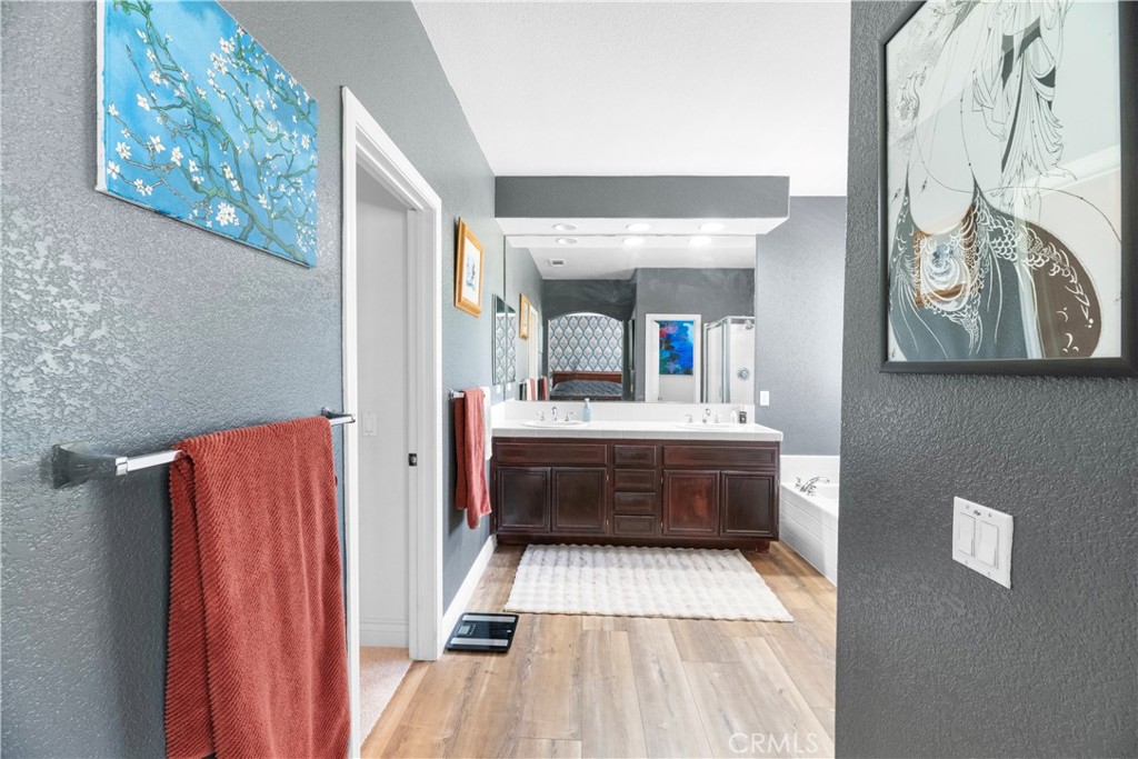 43312 Dodaro Drive Temecula, CA 92592 - Photo 28 of 58 a bathroom with a double vanity sink and a mirror