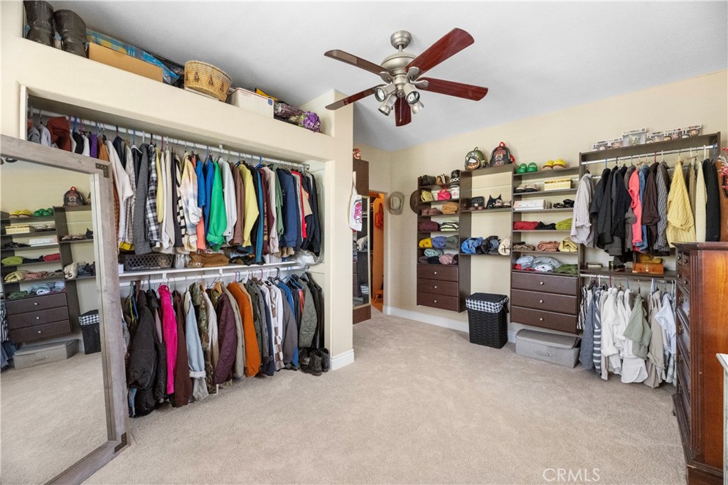 43312 Dodaro Drive Temecula, CA 92592 - Photo 34 of 58 a view of walk in closet with clothes and shoes