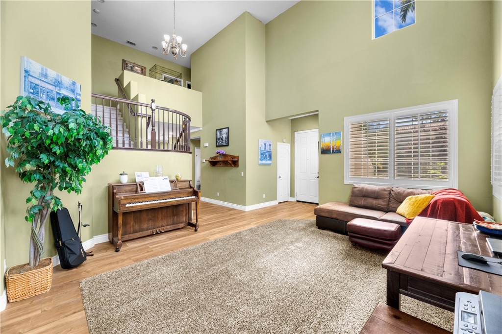 43312 Dodaro Drive Temecula, CA 92592 - Photo 6 of 58 a living room with furniture and a potted plant