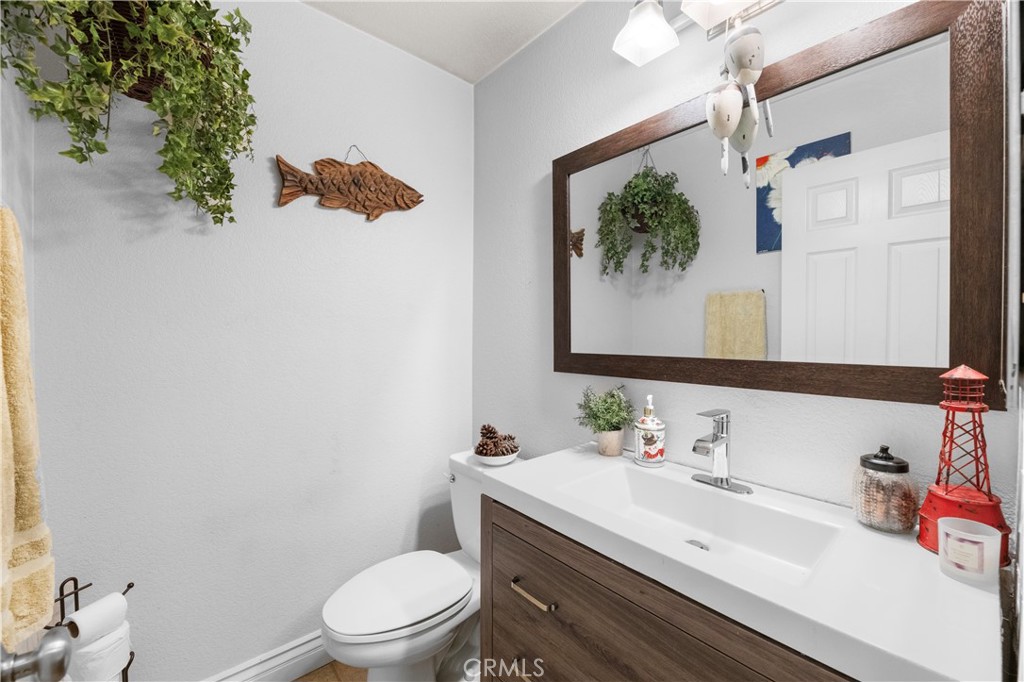 43312 Dodaro Drive Temecula, CA 92592 - Photo 10 of 58 a bathroom with a sink vanity mirror and toilet