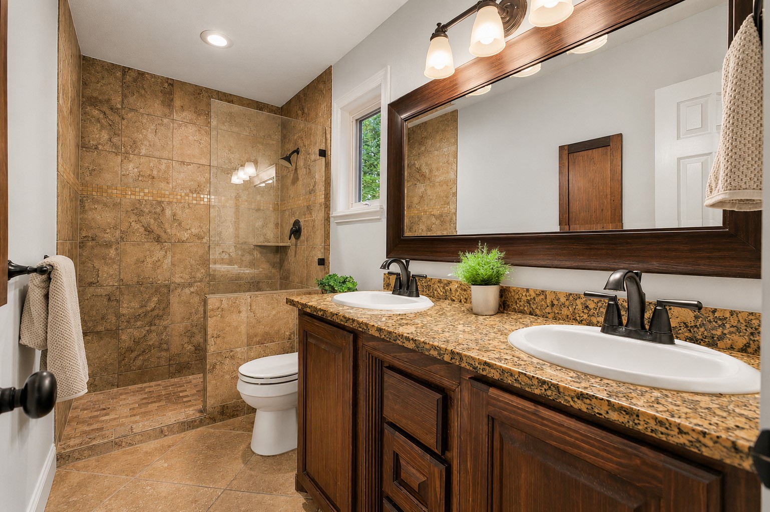 312 Springwood Drive Conroe, TX 77385 - Photo 25 of 50 Primary bathroom features double sinks and a large walk-in shower designed for comfort and convenience.