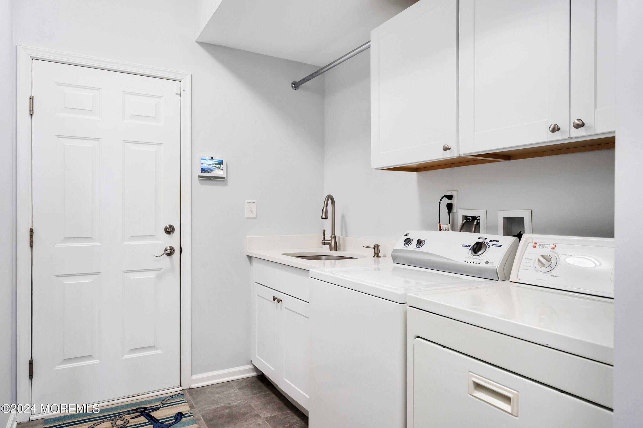 6 Lighthouse Point Road, Unit 701 Highlands, NJ 07732 - Photo 19 of 48 a utility room with sink dryer and washer
