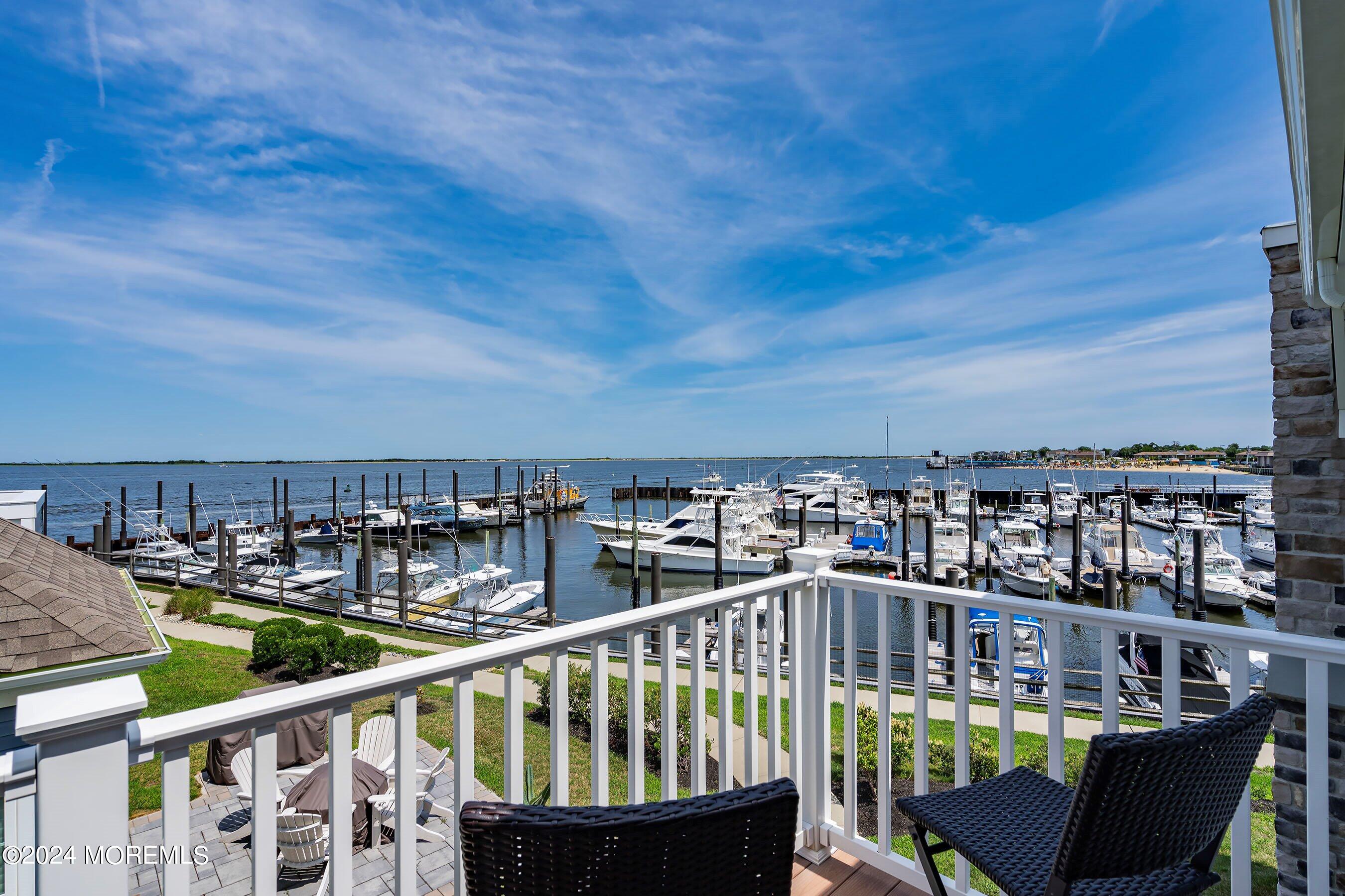 6 Lighthouse Point Road, Unit 701 Highlands, NJ 07732 - Photo 24 of 48 a view of a balcony with outdoor seating