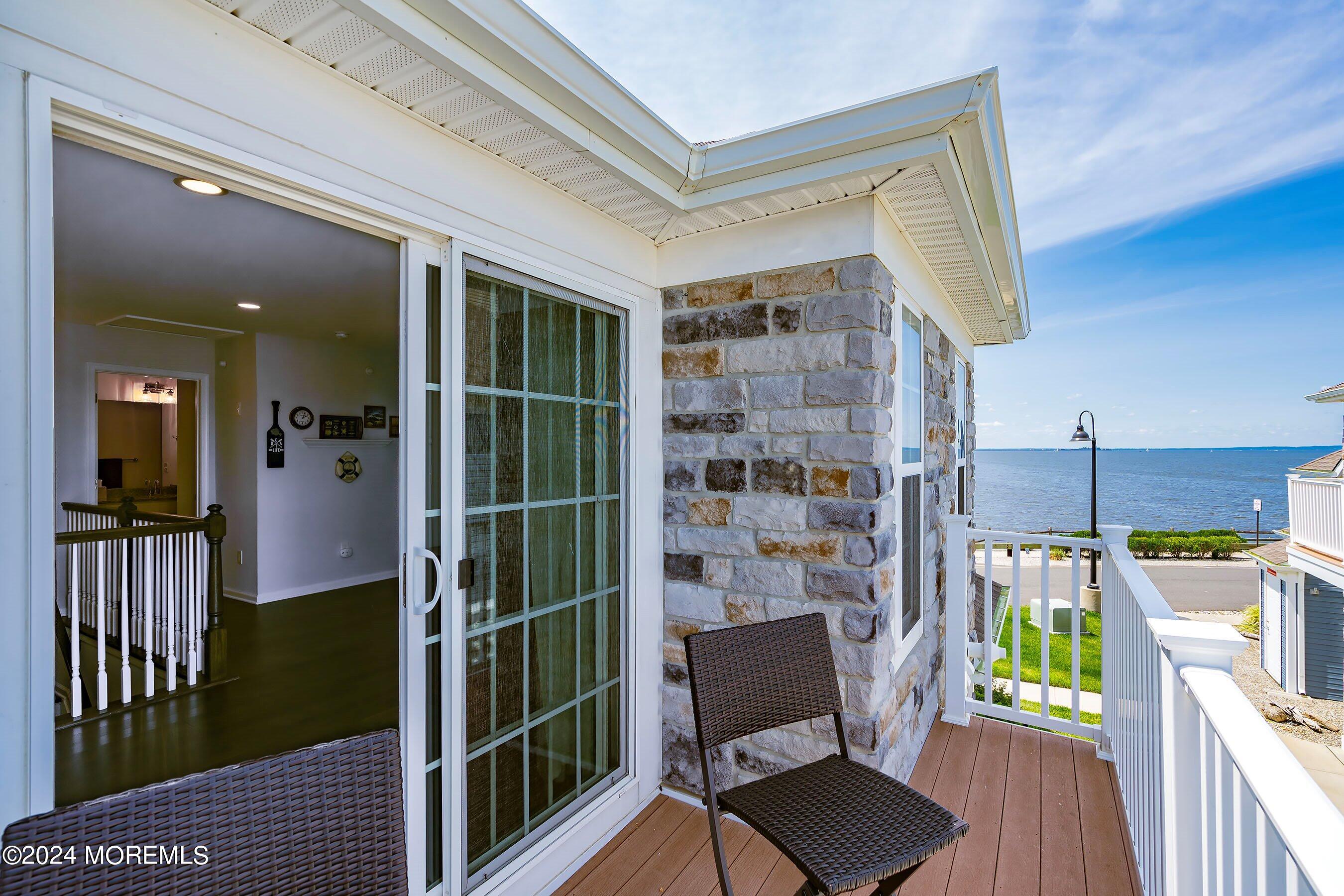 6 Lighthouse Point Road, Unit 701 Highlands, NJ 07732 - Photo 32 of 48 a view of a balcony with chairs