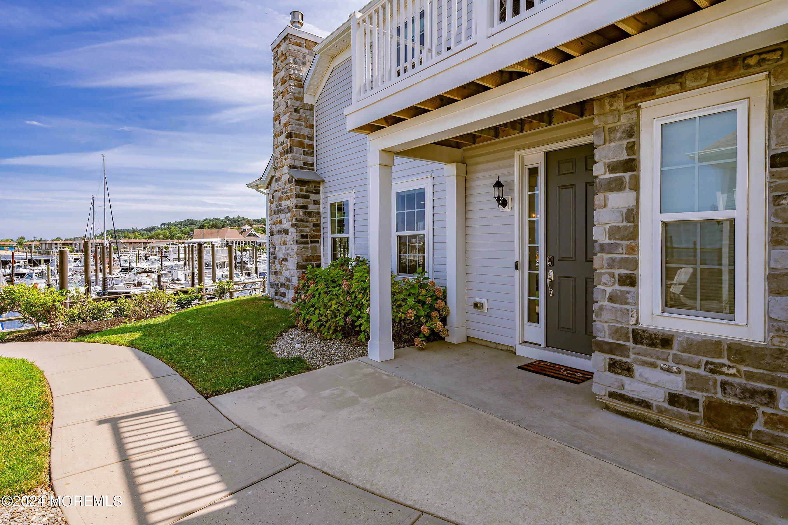 6 Lighthouse Point Road, Unit 701 Highlands, NJ 07732 - Photo 4 of 48 a front view of a building with a garden