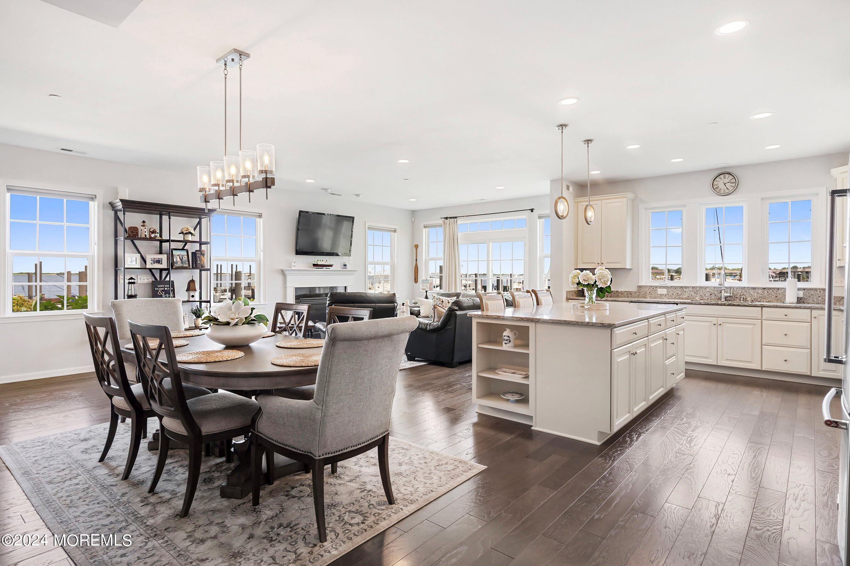 6 Lighthouse Point Road, Unit 701 Highlands, NJ 07732 - Photo 6 of 48 a large kitchen with a table and chairs