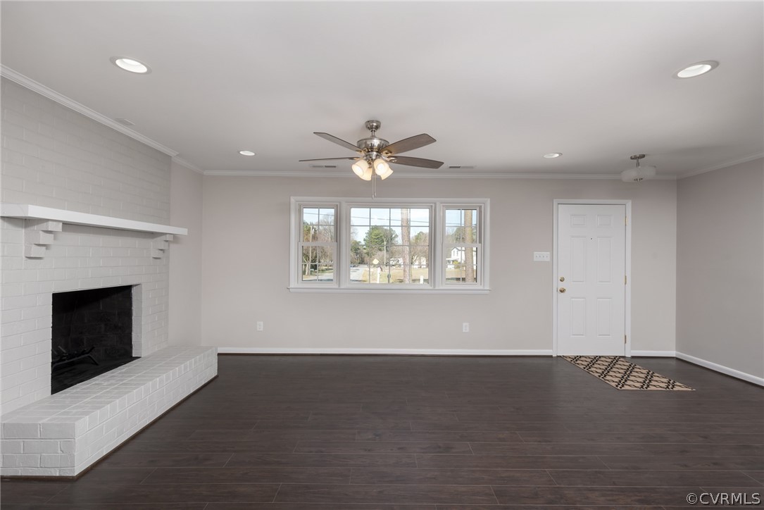 13423 Old Stage Road Chester, VA 23836 - Photo 8 of 25 an empty room with windows and fireplace