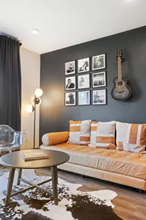 a bedroom with a bed and wall painting on the wall