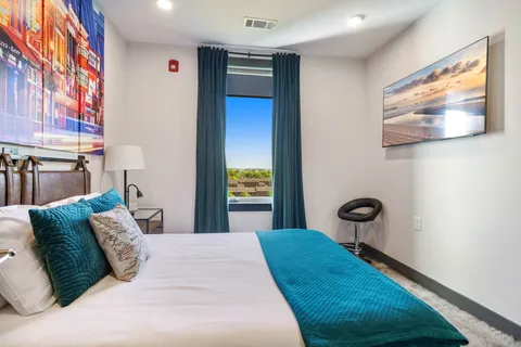 a kitchen with a sink a stove and chairs