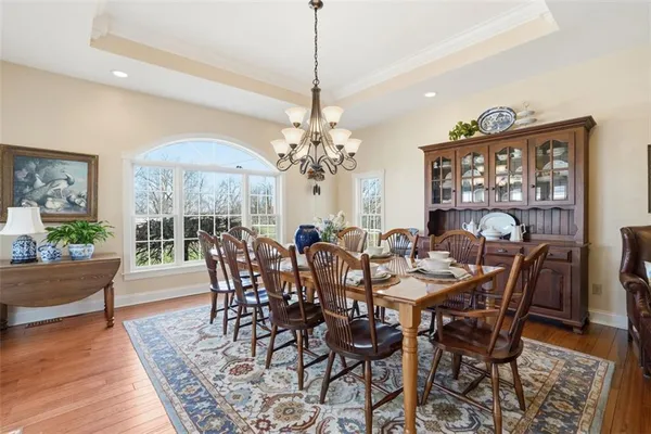 a view of a dining room with furniture window and wooden floor