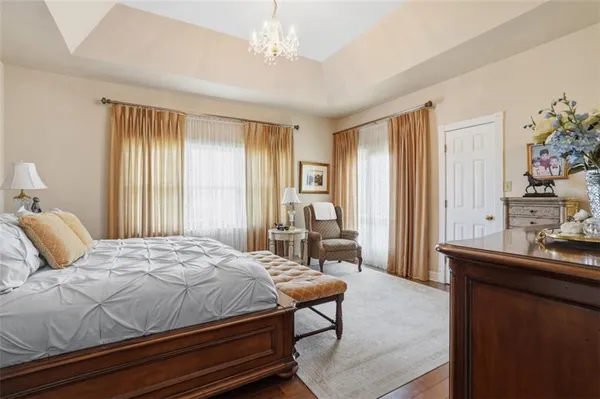 a bedroom with a bed and a table in it