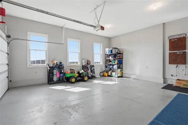 a view of a garage with a bike and car