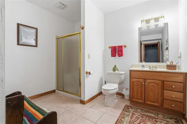 a spacious bathroom with a sink and a toilet
