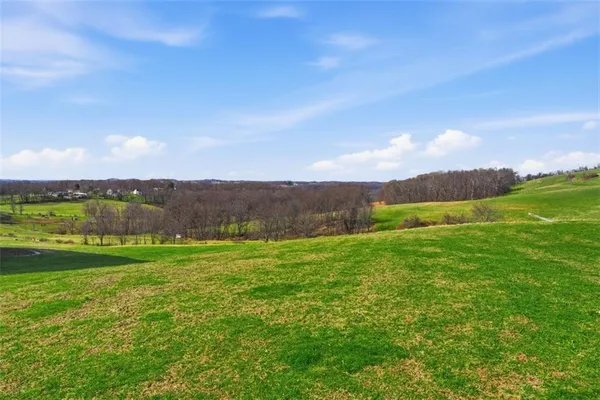 a view of an ocean and a yard
