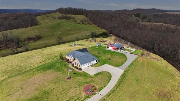 an aerial view of a house with outdoor space