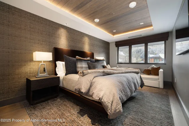 a bedroom with bed and window