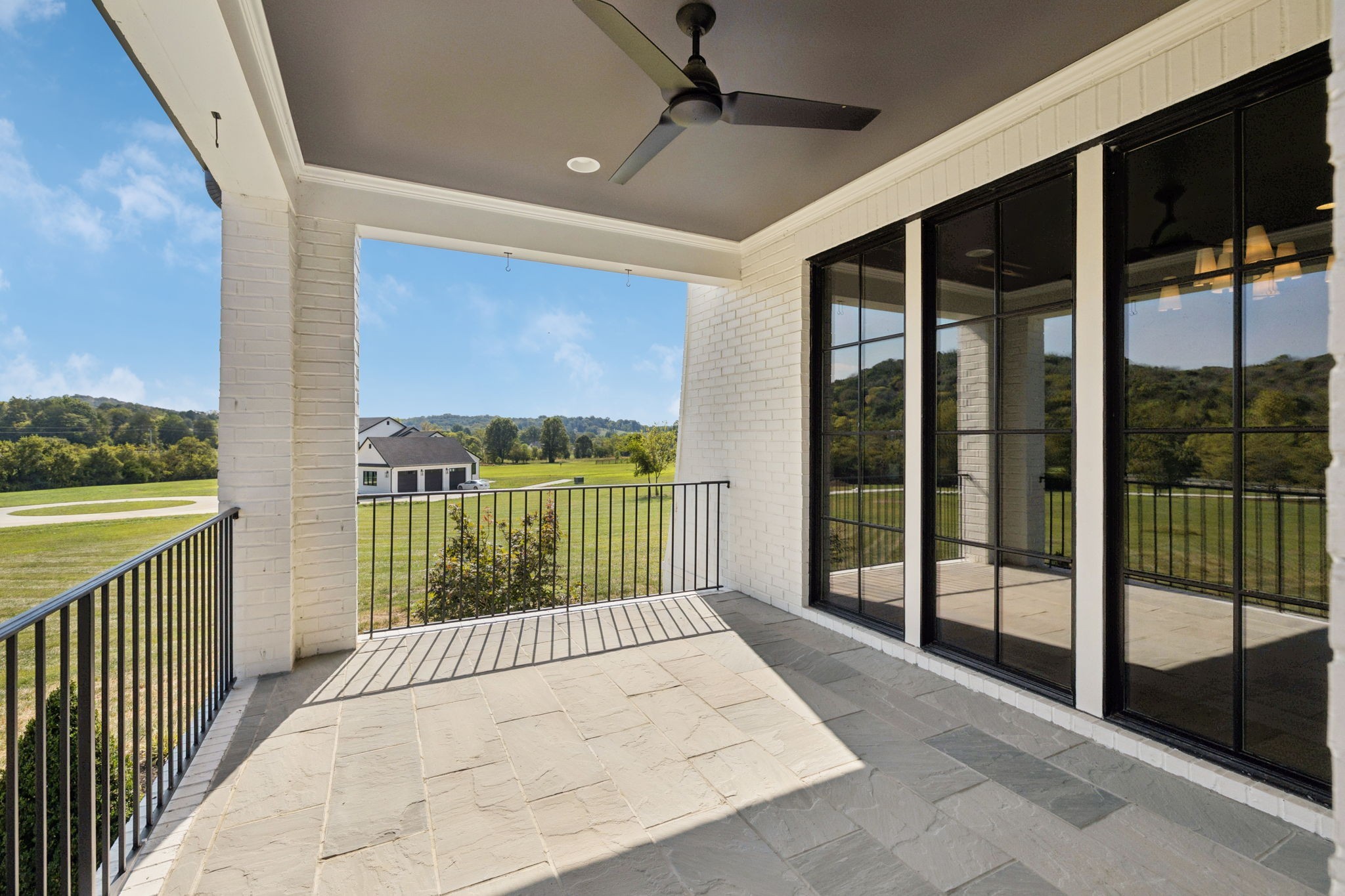 2245 Skinner Road Arrington, TN 37014 - Photo 15 of 98 a view of balcony with a floor to ceiling window and stairs