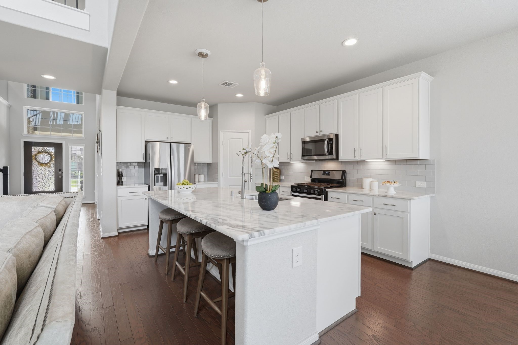 7522 Windsor View Drive Spring, TX 77379 - Photo 12 of 49 Large center island offers extra seating and everyday functionality.