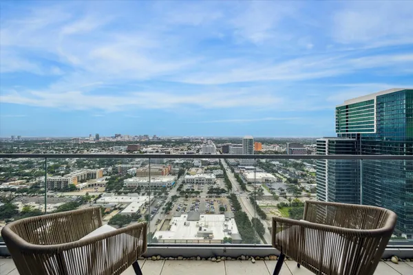 a view of a balcony with city view