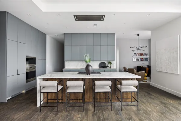 a white table and chairs in a kitchen