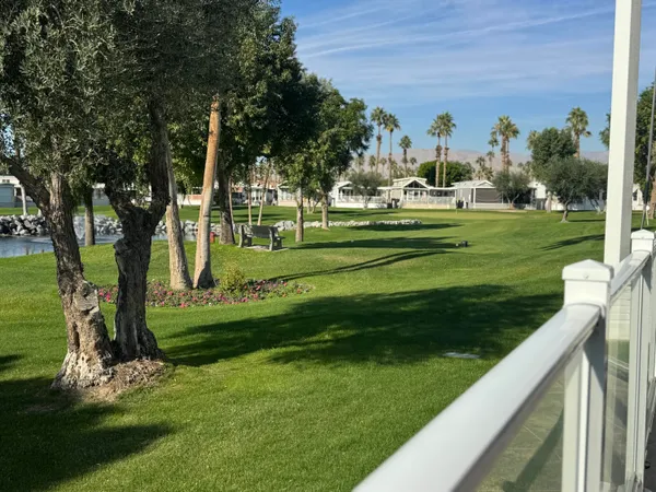 a view of a porch and a yard