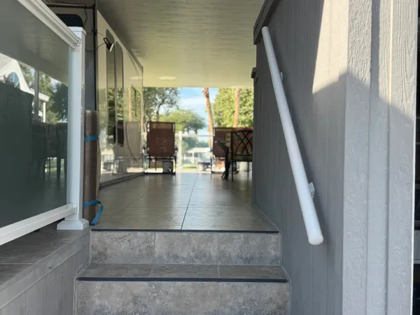 a view of living room with furniture and floor to ceiling window