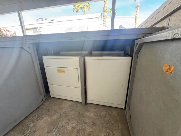 a utility room with dryer and washer