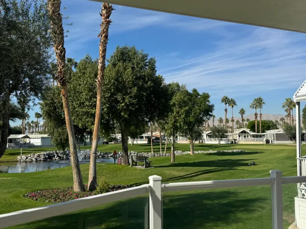 a view of a chairs and table in a patio