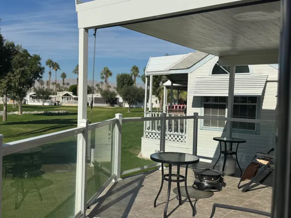 a lake view with a sitting space and garden