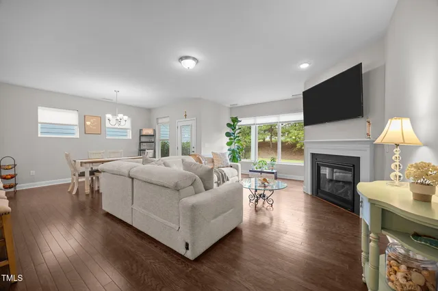 a large kitchen with kitchen island a dining table chairs and a sink