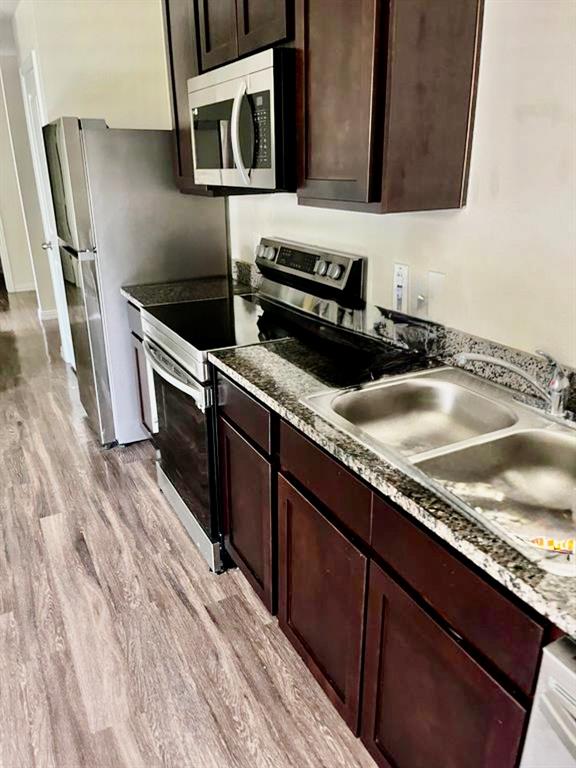 812 South 22nd Street Temple, TX 76501 - Photo 9 of 34 a kitchen with a sink and a microwave