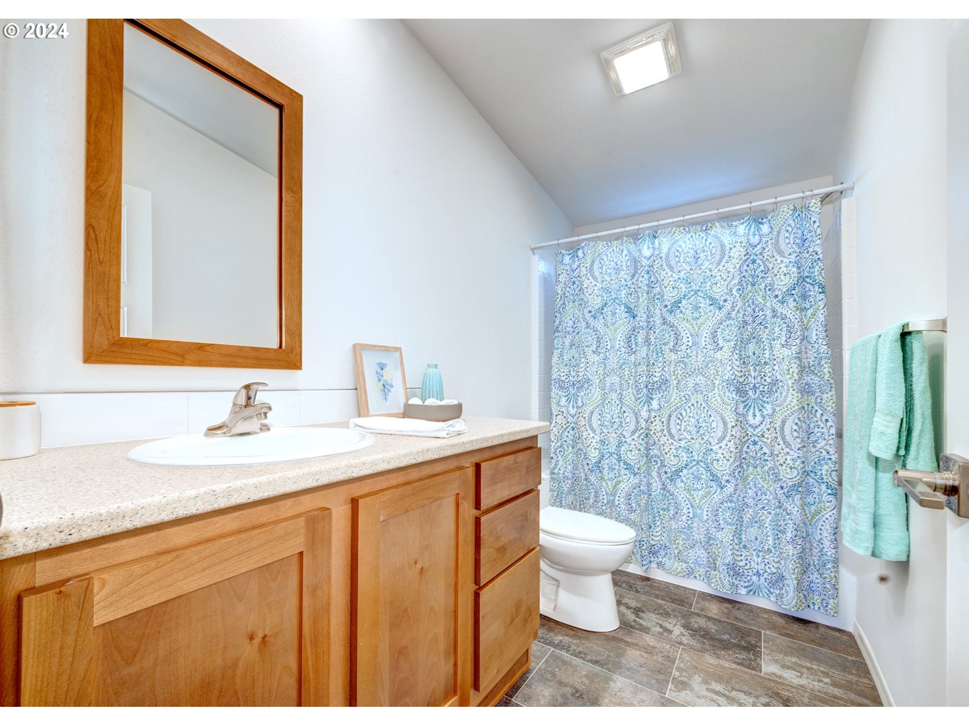 2417 Maia Loop Springfield, OR 97477 - Photo 18 of 21 a bathroom with a granite countertop sink a toilet and a mirror