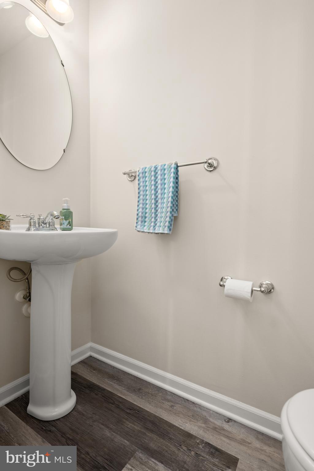 27548 Mayfield Road, Unit 42 Millsboro, DE 19966 - Photo 16 of 46 a bathroom with a sink and a mirror