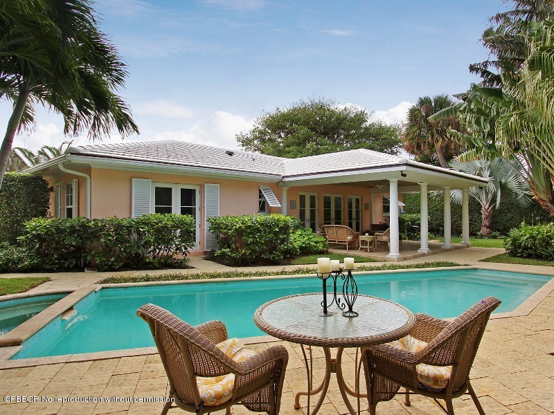241 Orange Grove Road Palm Beach, FL 33480 - Photo 1 of 10 a view of a house with swimming pool and a yard