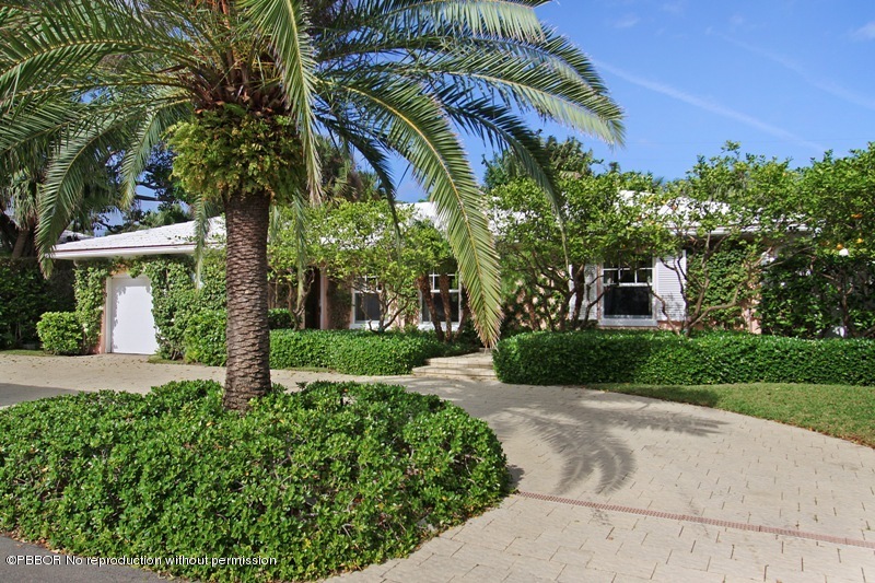 241 Orange Grove Road Palm Beach, FL 33480 - Photo 2 of 10 a front view of a house with a yard