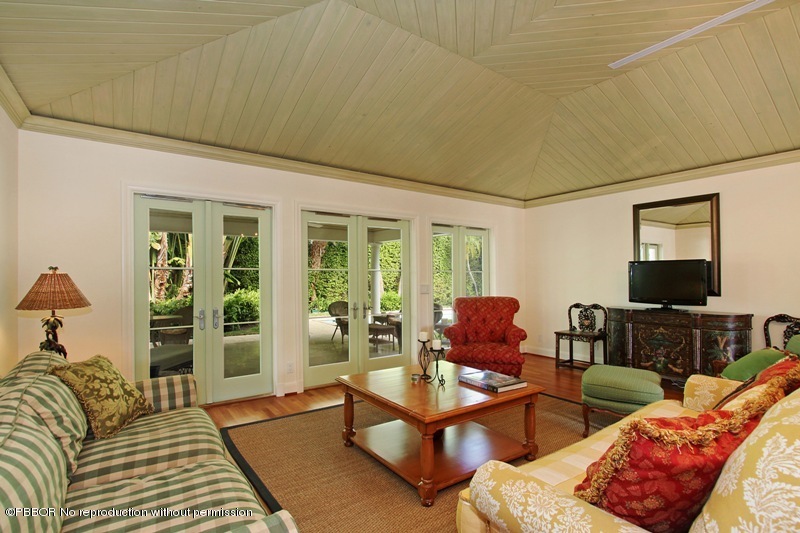 241 Orange Grove Road Palm Beach, FL 33480 - Photo 3 of 10 a living room with furniture and a flat screen tv