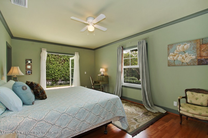 241 Orange Grove Road Palm Beach, FL 33480 - Photo 6 of 10 a bed sitting in a bedroom next to a window