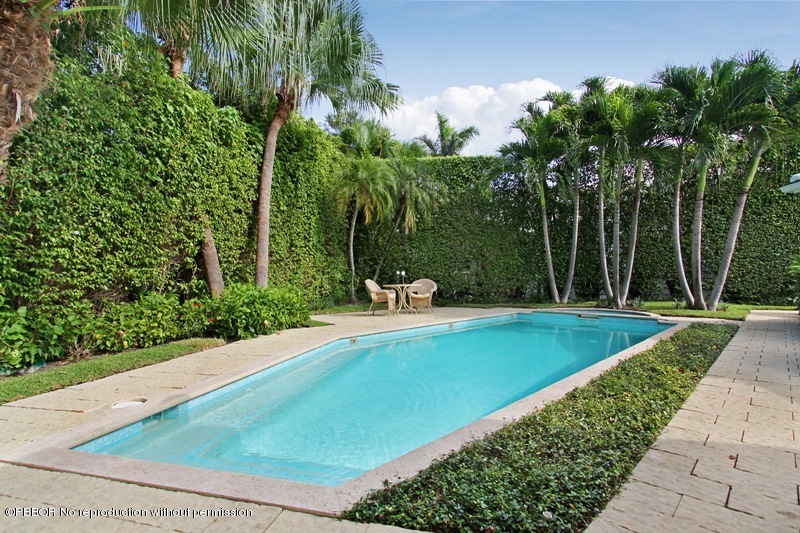 241 Orange Grove Road Palm Beach, FL 33480 - Photo 9 of 10 a swimming pool with lots of green space