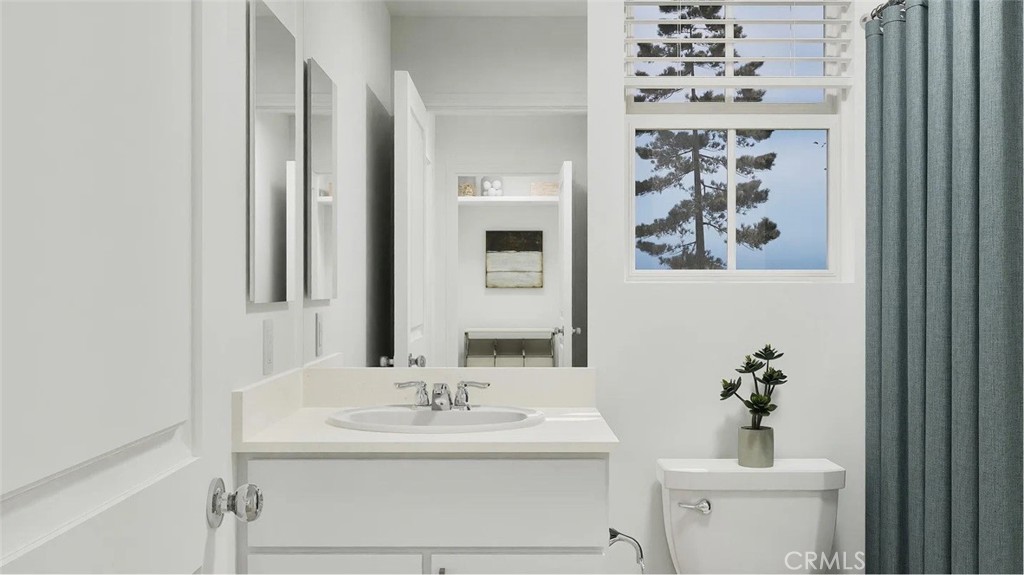 1234 Yeager Avenue Rialto, CA 92376 - Photo 7 of 17 a bathroom with a sink a toilet and a mirror