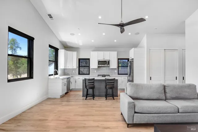 a spacious bedroom with a bed and a view of bathroom