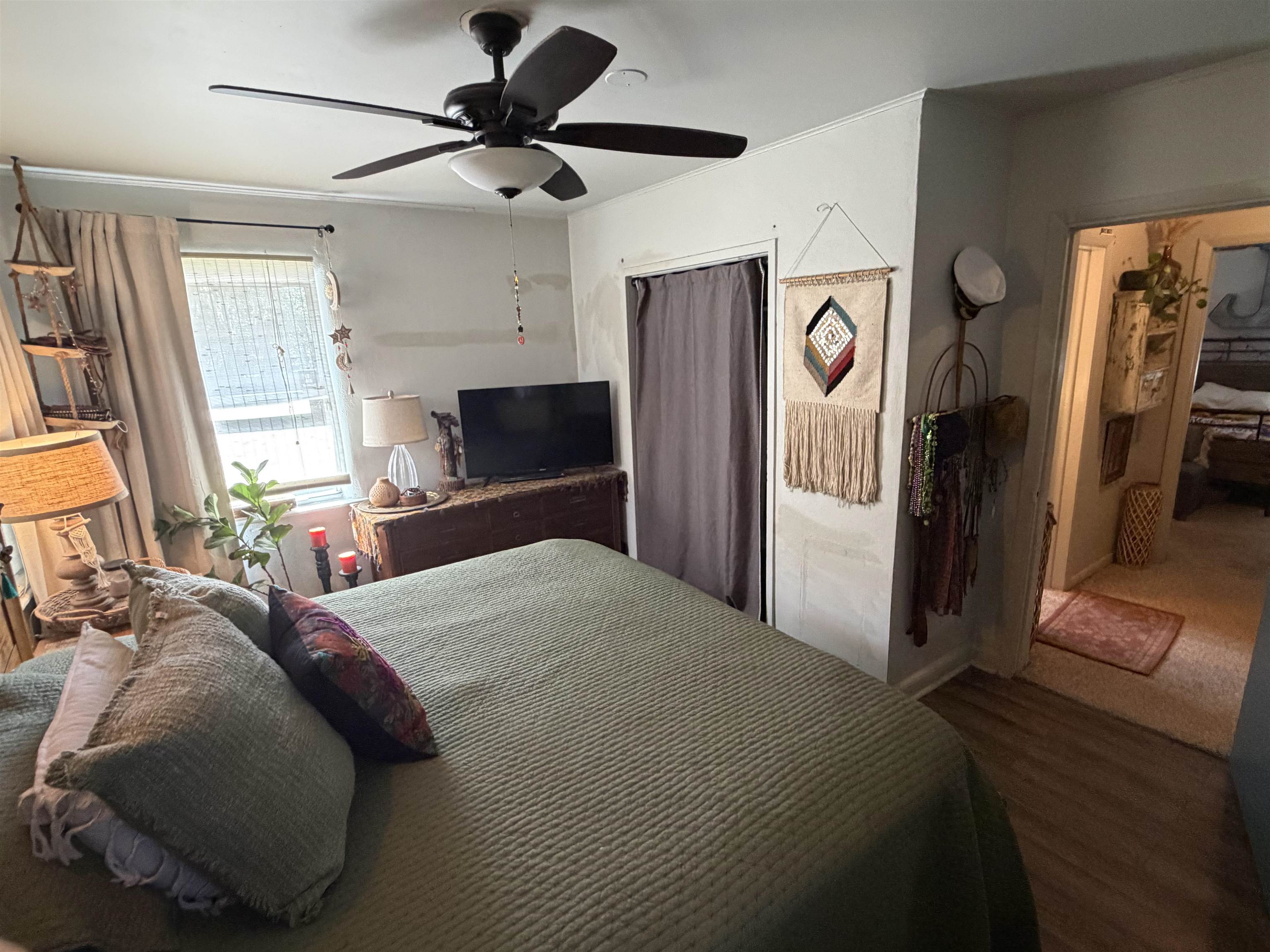 323 Sisco Road Pomona Park, FL 32181 - Photo 29 of 31 a bedroom with a bed and a flat tv screen on dresser