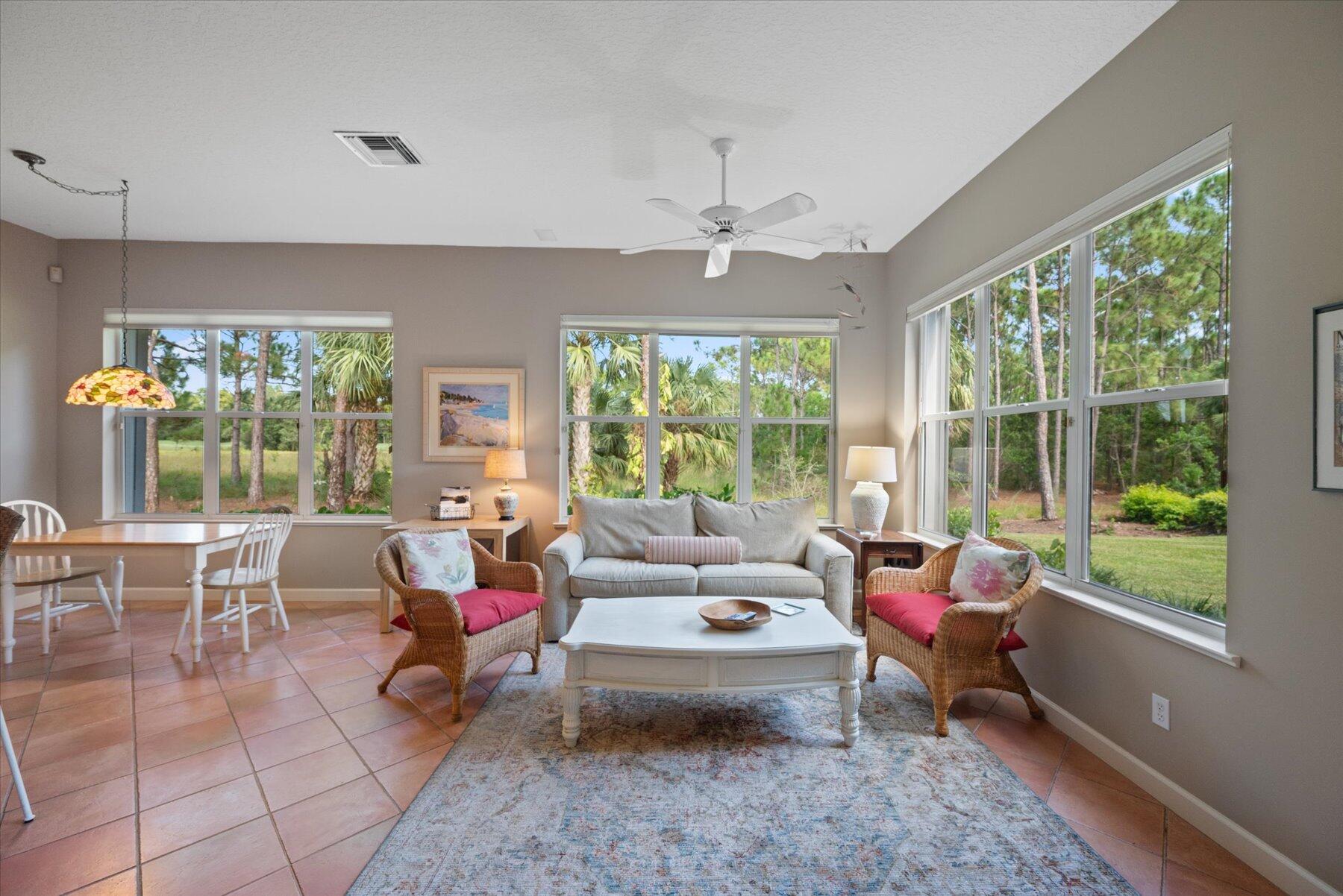 3498 Southeast Doubleton Drive Stuart, FL 34997 - Photo 14 of 42 a living room with furniture and a large window