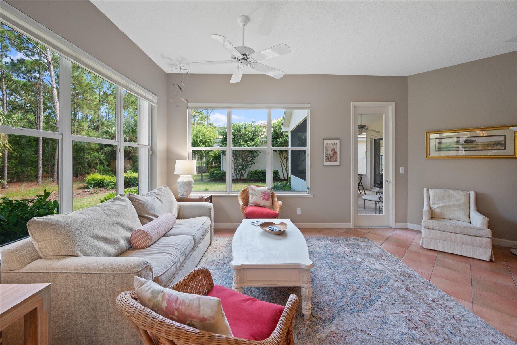 3498 Southeast Doubleton Drive Stuart, FL 34997 - Photo 15 of 42 a living room with furniture and a large window