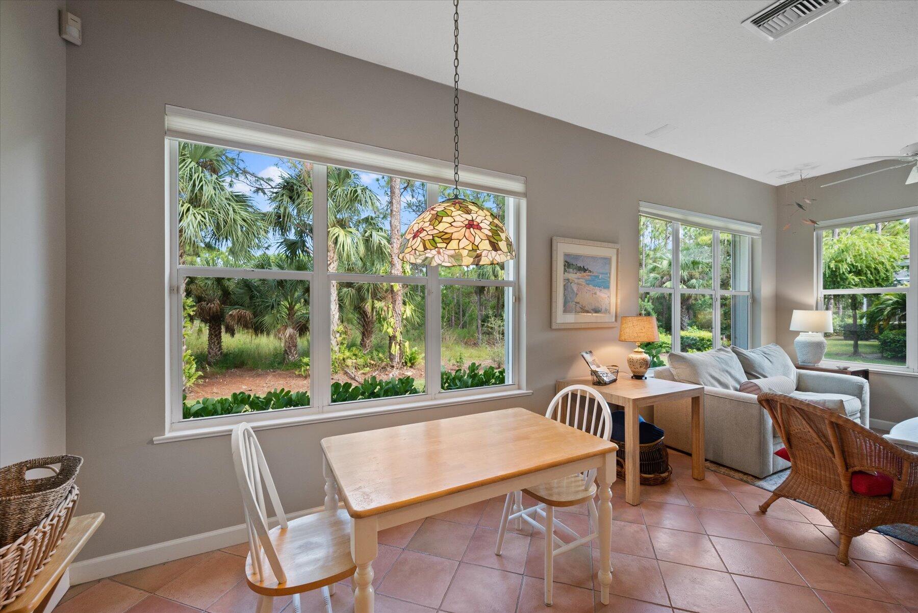 3498 Southeast Doubleton Drive Stuart, FL 34997 - Photo 16 of 42 a living room with furniture and a large window