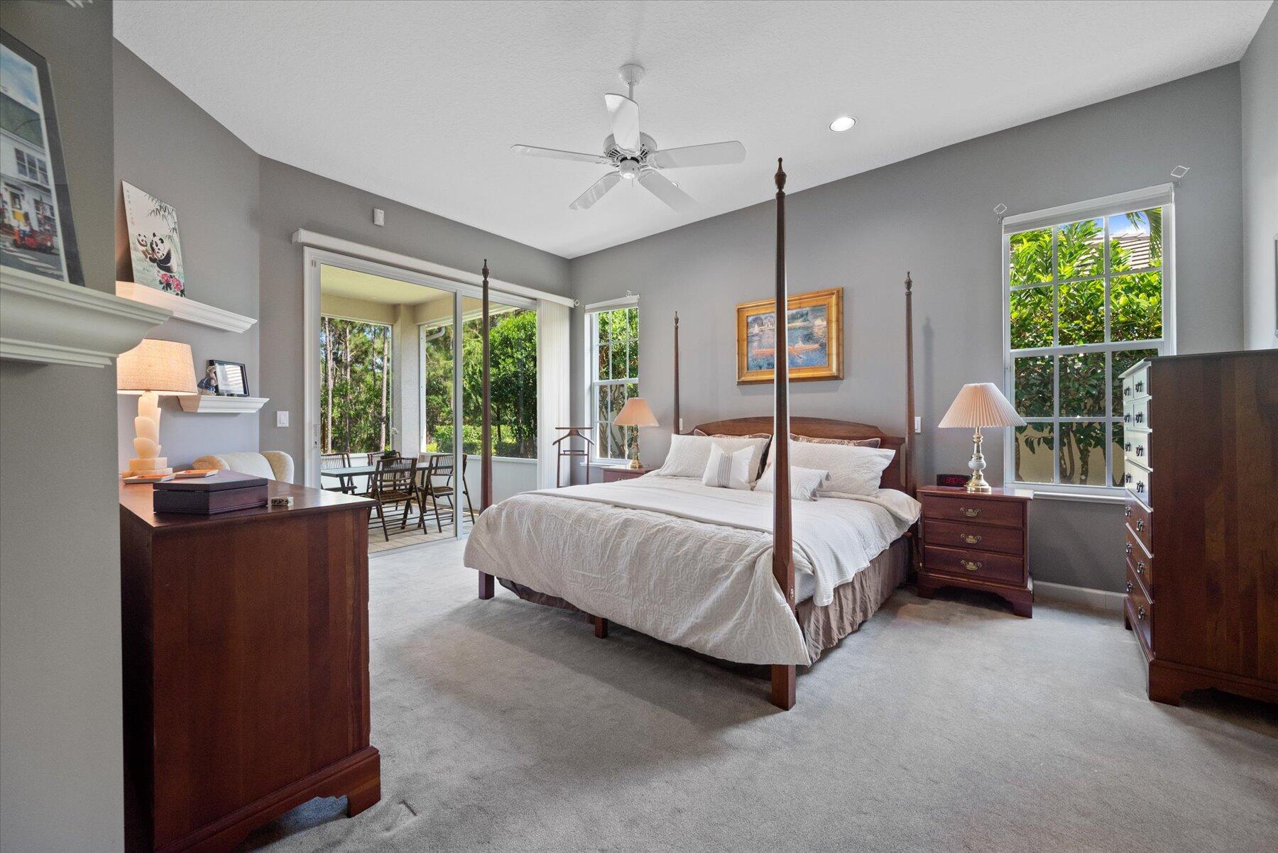 3498 Southeast Doubleton Drive Stuart, FL 34997 - Photo 18 of 42 a bedroom with a large bed and a window