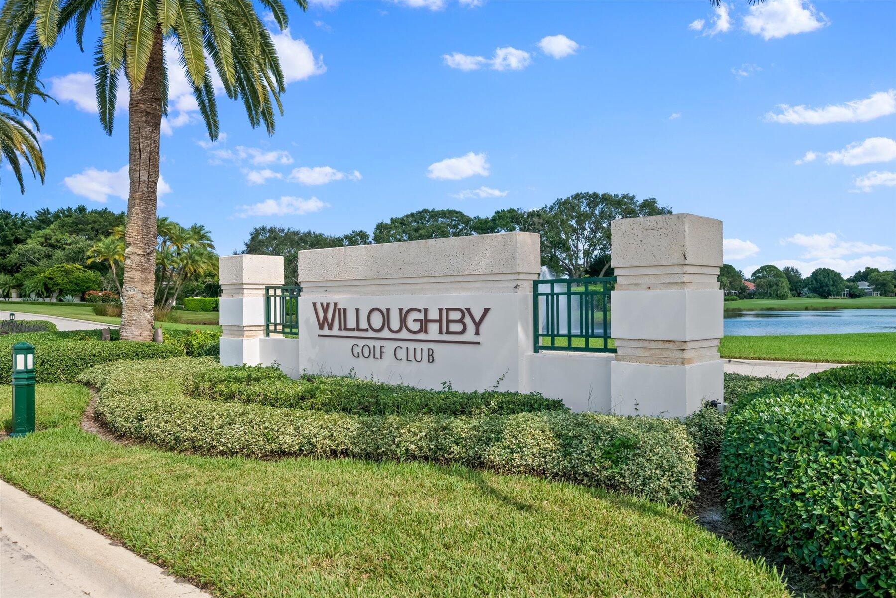 3498 Southeast Doubleton Drive Stuart, FL 34997 - Photo 2 of 42 a sign of golf club on a wall under a tree