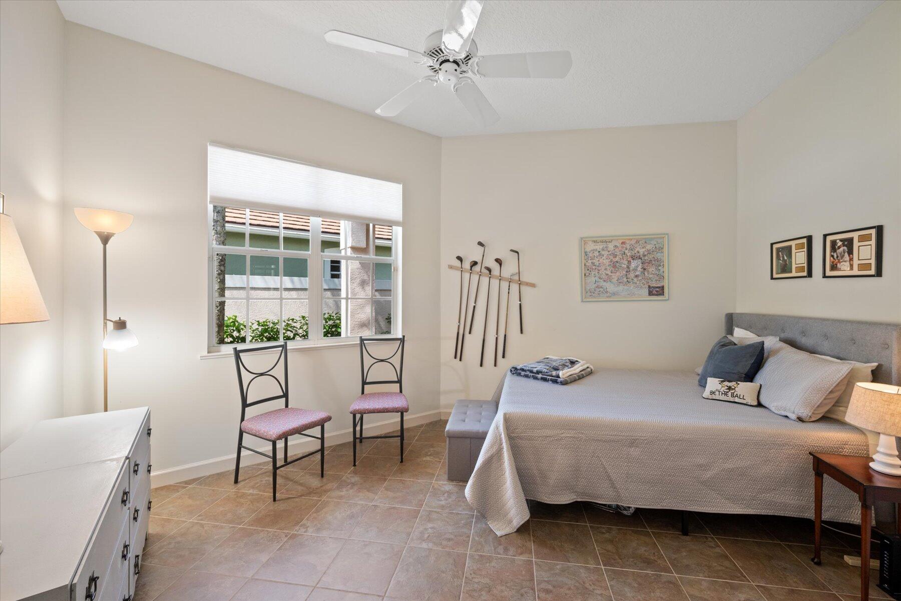3498 Southeast Doubleton Drive Stuart, FL 34997 - Photo 24 of 42 a bedroom with furniture and a window